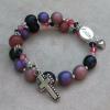 Pink and purple Czech glass with pewter cross and sterling "Faith" joiner.