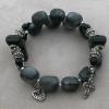 Large grey marble Aves, black Czech glass, Swarovski jet crystals, sterling silver spacers, Paters that are black agate with sterling silver grommets,  and pewter rondelles, heart charm, and cross.
