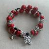 Red fossil Aves with Swarovski crystals and pewter rondelles, cross, and heart charm.