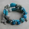Aqua crazy lace agate with turquoise Paters, sterling silver spacers, and pewter rondelles, cross, and heart charm