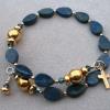 Blue lapis tear drops with gold plated heisi and Paters, and blue Swarovski crystals.
