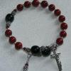 Red fossil and black Czech glass. "St. Isaac Jogues" per the client's request.