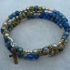 Iridescent satin blue glass with cloissone Paters and gold plated diamond-cut cross.