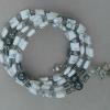 Square white howlite with hematite Paters and pewter rondelles, cross, and heart charm.