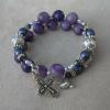 Purple crazy lace agate with diamond cut aluminum Paters, dark purple Czech glass, Swarovski amythest and violet crystals, sterling silver spacers, silver plated pewter cross, and pewter heart charm and rondelles
